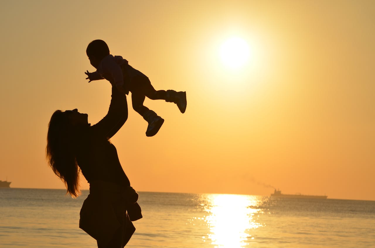 A women lifting her child